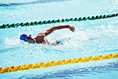 Swimmers racing in pool