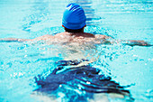 Swimmer floating in pool