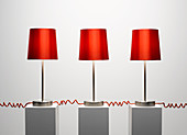 Red lamps connected by red cords