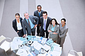 Smiling business people at table