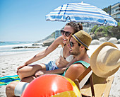 Happy couple relaxing on beach