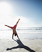 Man in swim trunks on beach