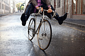 Businessman riding bicycle