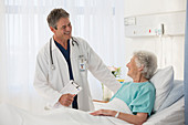 Doctor talking to elderly patient