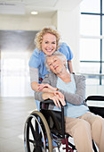 Smiling nurse and elderly patient