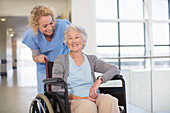 Nurse and aging patient smiling