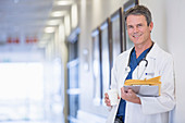 Smiling doctor in hospital corridor