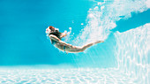 Woman swimming underwater