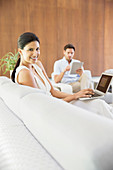 Couple relaxing in living room