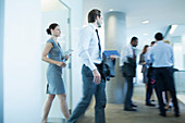 Business people walking in office
