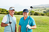 Smiling senior men on golf course