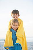 Brother and sister wrapped in towels