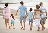 Family holding hands on beach