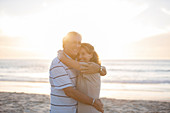 Senior couple hugging on beach