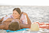 Couple relaxing together on beach