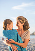 Older woman holding granddaughter