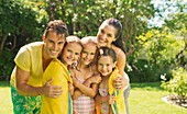 Family relaxing together in backyard