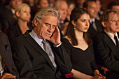 Man sleeping in theatre audience
