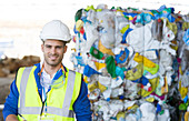 Worker smiling in recycling centre