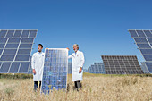 Scientists holding solar panel
