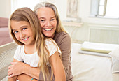 Grandmother hugging granddaughter