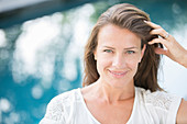 Woman smiling at poolside