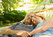 Couple sleeping in hammock