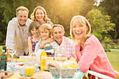Family at table in backyard