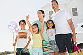 Enthusiastic family with beach gear