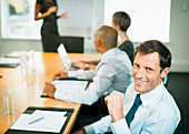 Businessman smiling in meeting