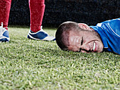Soccer player falling on field