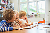 Children using home office together