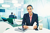 Businesswoman smiling in cafe