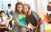 University students smiling in lounge