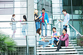 University students relaxing on steps