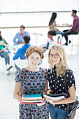 University students smiling in lounge