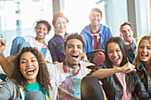 Friends cheering together indoors