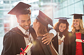 Graduates hugging