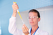 Scientist using pipette