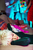 Woman sleeping on sofa at party