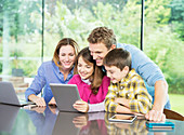 Family using digital tablet together