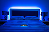 digital tablet on glowing bed
