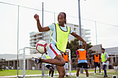 Soccer player training on field