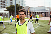 Soccer player smiling on field