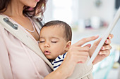 Mother with sleeping baby girl