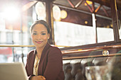 Businesswoman smiling in restaurant