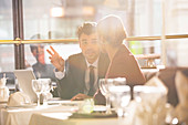 Business people talking in restaurant