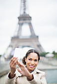Woman taking self-portrait in Paris