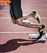 Runner taking off from starting blocks