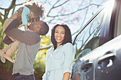 Happy woman with husband and daughter